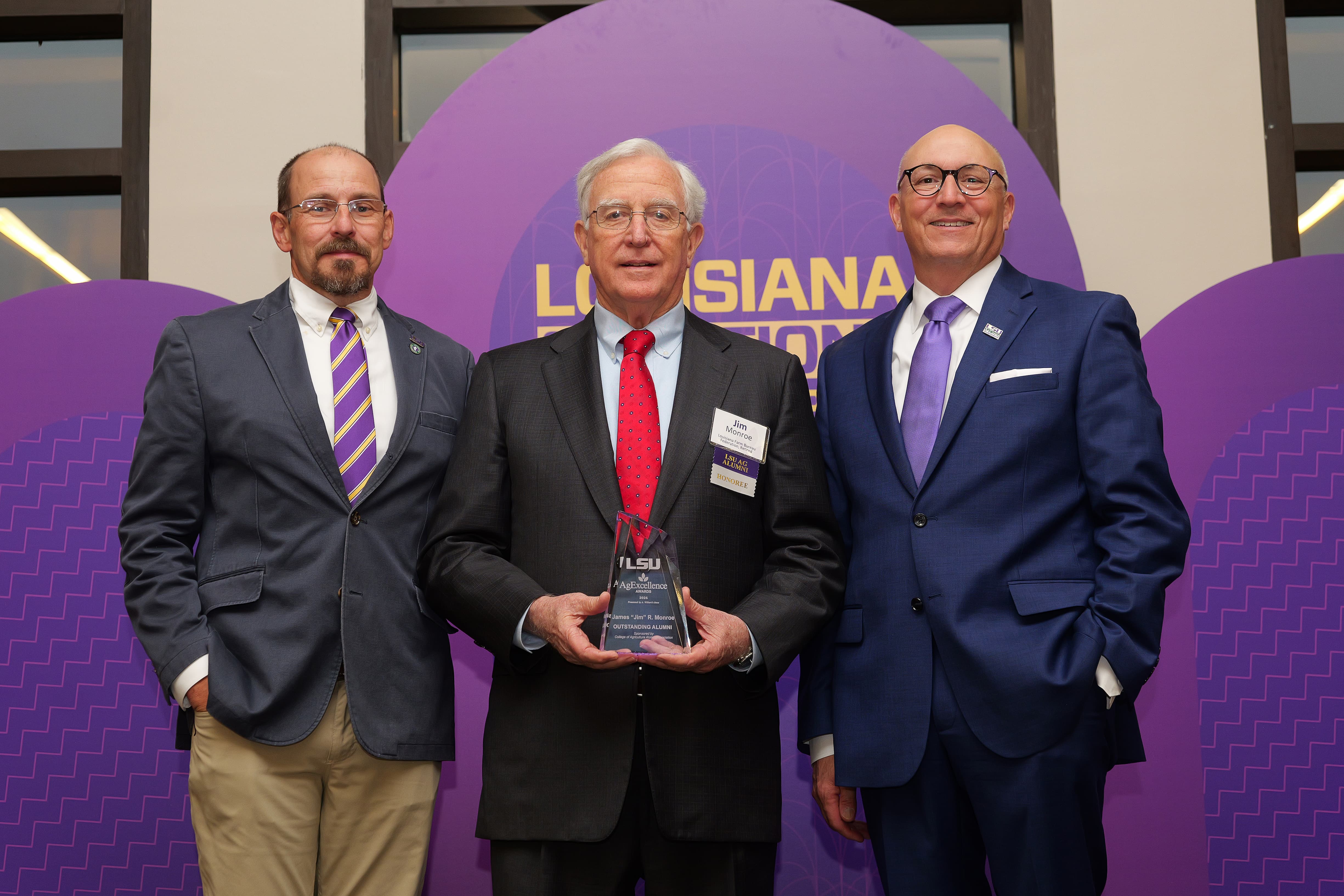 Jim Monroe receiving award. 
