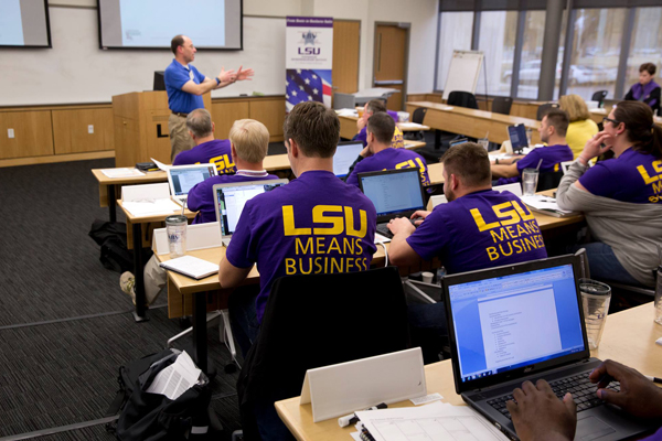 stuents in class all wearing tshirts that say LSU Means Business