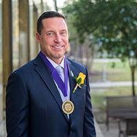 Kurt Ainsworth headshot wearing his Hall of Distinction medal