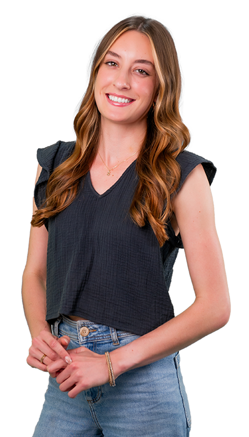 Svenya wears jeans and a black blouse with ruffle-edge sleeves