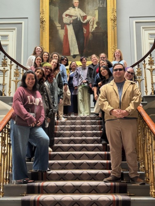 Study abroad students pose on a stairwell