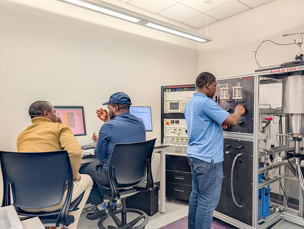 Students operating lab equipment