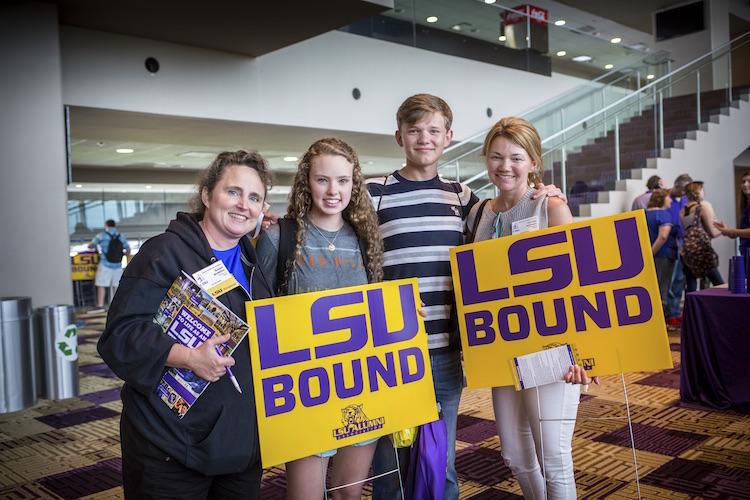 students with "LSU Bound" signs