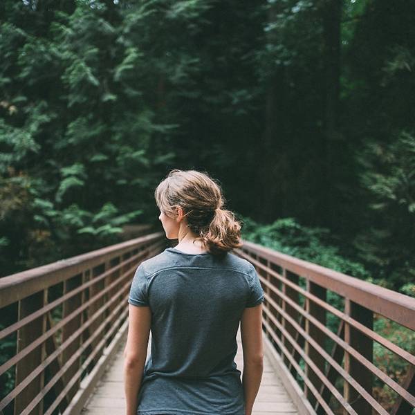 person walking on bridge