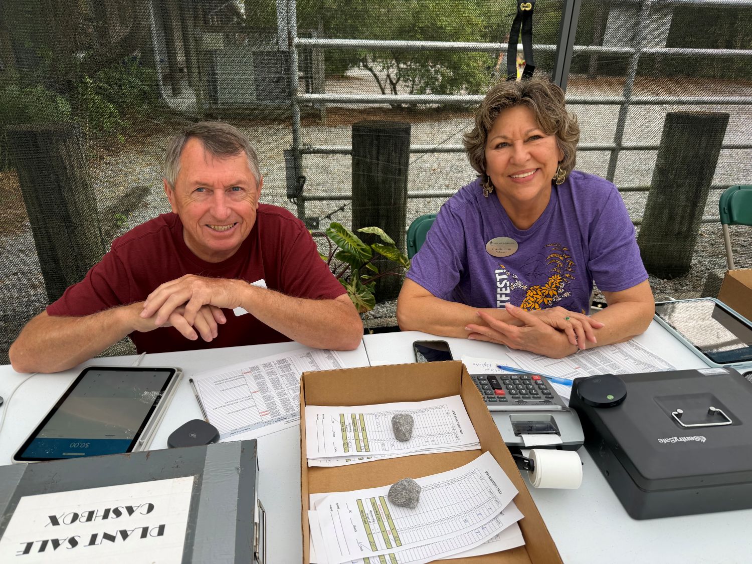 bill griffin and claudia brian cashiering at plant sale