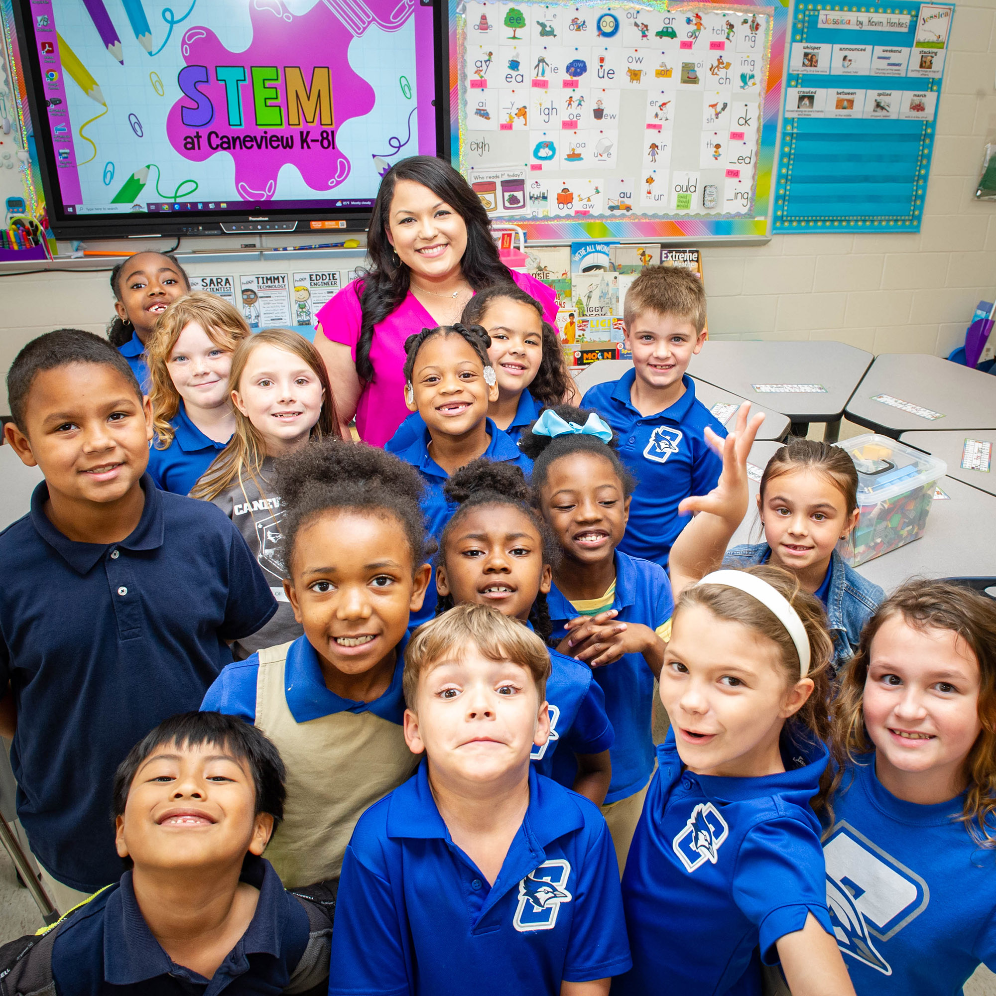 Morgan Decuir with a group of her students in classroom