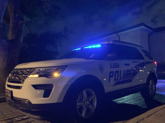 Police vehicle stationed on campus at night