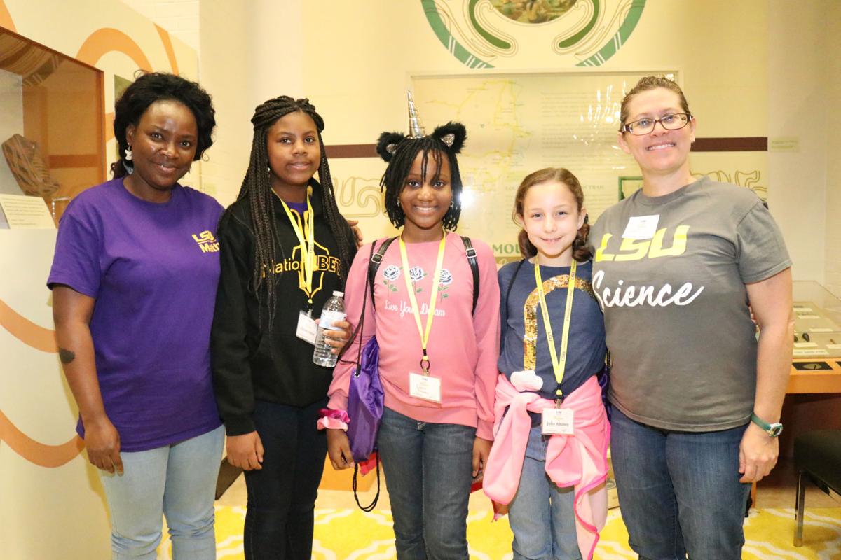 Girls' Day at the Museum participants with two LSU women scientists.