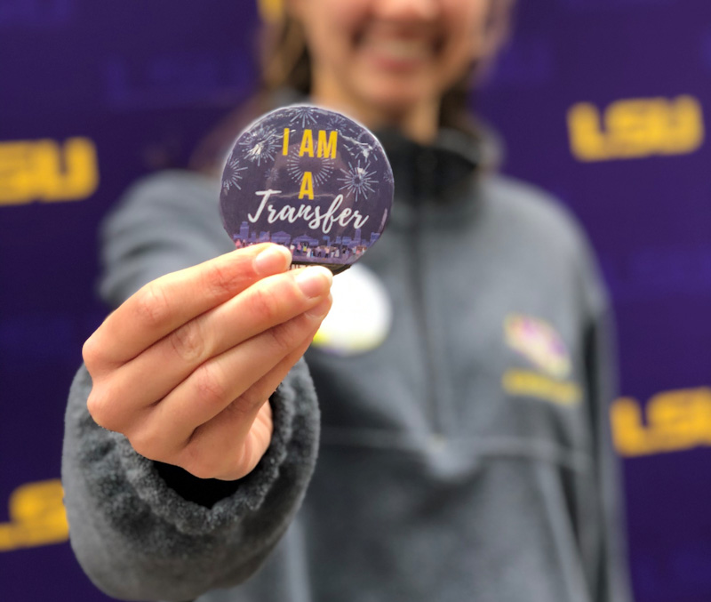 Student holding "I am a transfer" button